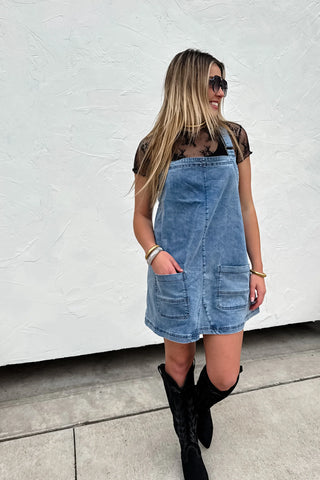 Stretch Denim Jumper Dress with Adjustable Straps – Comfortable denim jumper dress with adjustable straps, front pockets, and a versatile design for easy styling.
