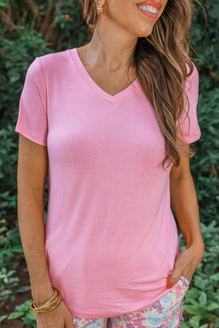 Woman wearing the Basic V-Neck Tee, styled casually for a simple, chic look.