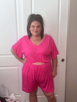 Woman wearing the Ryan Reversible Cutout Jumper, styled casually for a chic, versatile look.