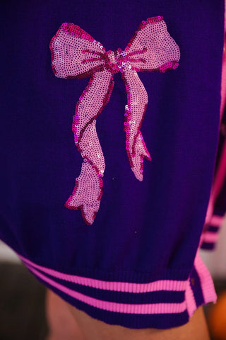 Purple jacket with a pink sequin bow detail