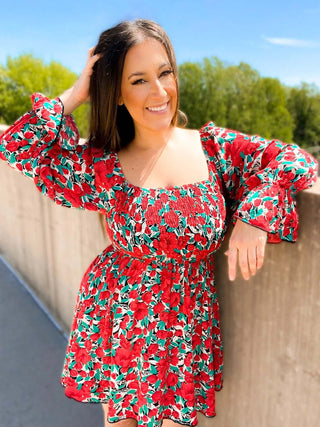 Woman wearing the Sabrina Smocked Bell Sleeve Dress, styled for a chic and feminine look perfect for casual outings or special occasions.