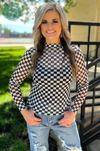 Woman wearing the Checkered Mesh Top, styled casually or dressed up for an edgy, chic look.