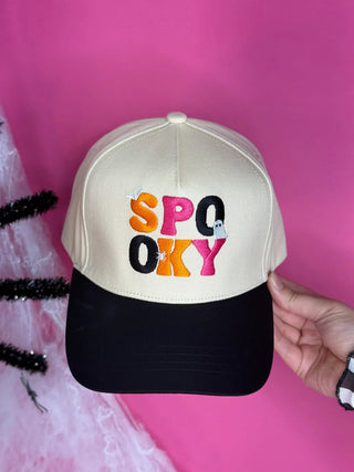 Cream canvas crown and black canvas bill snapback hat with “Spooky Vibes” Halloween embroidery; adjustable fit for festive fall style.
