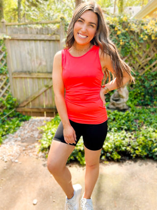 Woman wearing the Sasha Suck & Tuck Biker Short, styled for a chic, comfortable look.