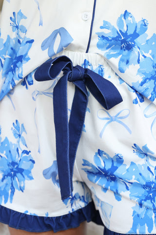 Close-up view of the soft fabric and floral print on the Blossom Floral Pajamas, highlighting their cozy and charming design.