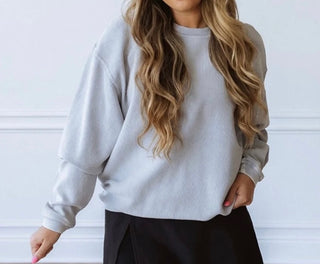 Close-up view of the corded texture and soft fabric of the Luxury Corded Crew Sweatshirt in Light Blue Grey.