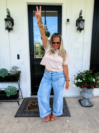 Woman wearing the Clover Front Pocket Jeans, styled casually for a chic, everyday look.