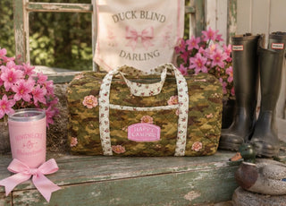 Blakeley floral camo quilted weekender bag with zip closure, interior pocket, and spacious travel design. 