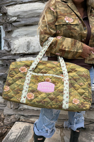 Blakeley floral camo quilted weekender bag with zip closure, interior pocket, and spacious travel design. 