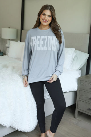 Woman wearing the Freezing Embroidered Ribbed Pullover, styled casually with jeans for a cozy, chic look.