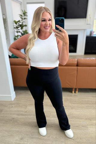 Woman wearing the Fallon Flare Suck and Tuck Leggings, styled casually for a flattering, chic look.