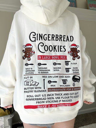 White hoodie with gingerbread cookies recipe graphic on the back