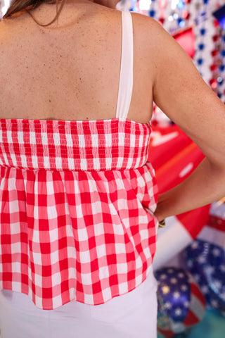 Back view of red plaid top showing stretchy smocked detail for a comfy and flattering fit.
