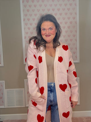 Love Story cardigan with hearts for women featuring a flattering relaxed fit and charming heart design, a cozy statement piece for fashion trends, women’s clothing, and plus size trends.