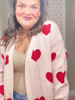 Love Story cardigan with hearts for women featuring a flattering relaxed fit and charming heart design, a cozy statement piece for fashion trends, women’s clothing, and plus size trends.