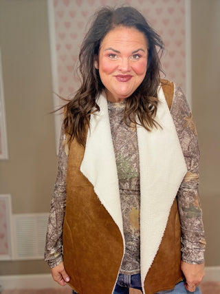 Collins suede vest with sherpa lining for women featuring a soft suede exterior and cozy sherpa interior, perfect for layering and women’s clothing styles.