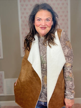 Collins suede vest with sherpa lining for women featuring a soft suede exterior and cozy sherpa interior, perfect for layering and women’s clothing styles.