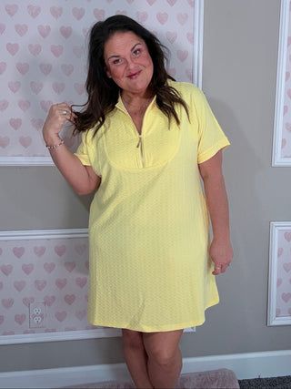 Yellow Ezra dress with textured fabric, short sleeves, and stylish front zipper accent.
