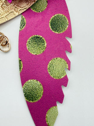 Close up of one of the feathers - pink and gold polka dots. 