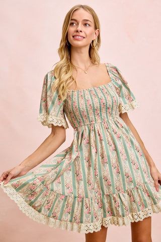 Woman wearing a floral dress with a pink background