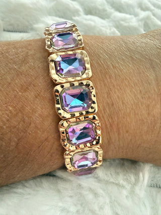 Gold stretch bracelet with faceted crystal gemstones available in multiple colors.