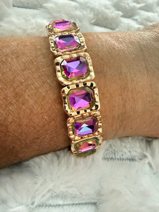 Gold stretch bracelet with faceted crystal gemstones available in multiple colors.