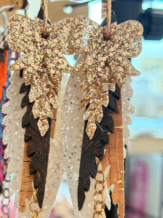 Decorative hair clip with gold and black details on a blurred background