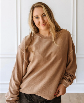 Woman wearing the Luxury Corded Crew Sweatshirt in Light Mocha, styled casually for a chic, comfortable look.