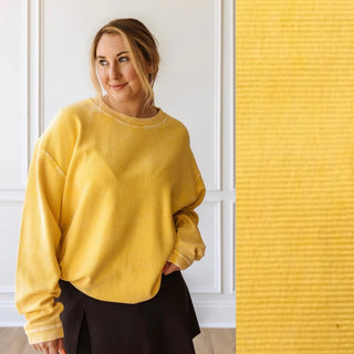 Close-up view of the corded texture and luxurious fabric of the Luxury Corded Crew Sweatshirt in Gold.