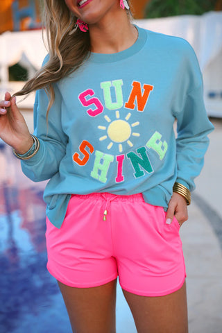 Close-up of soft, breathable fabric and adjustable waistband of the Neon Pink Everyday Shorts.