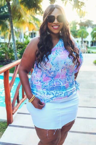 Model wearing Sassy Moment Colorful Snake Top with one-shoulder silhouette and vibrant snake print.