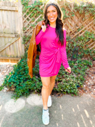 Woman wearing the Carrie Crossover Waist Faux Wrap Dress, styled for a chic and elegant look perfect for any occasion.