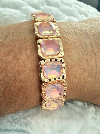 Gold stretch bracelet with faceted crystal gemstones available in multiple colors.