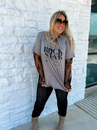 Woman wearing the Roxy Lace Top, styled for a feminine, elegant look.