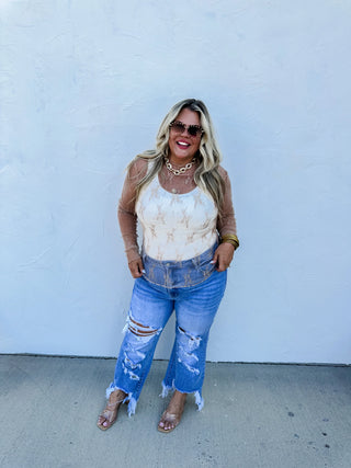 Woman wearing the Roxy Lace Top, styled for a feminine, elegant look.