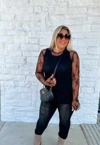 Roxy Lace Top styled with accessories for a chic, feminine outfit perfect for day-to-night wear.
