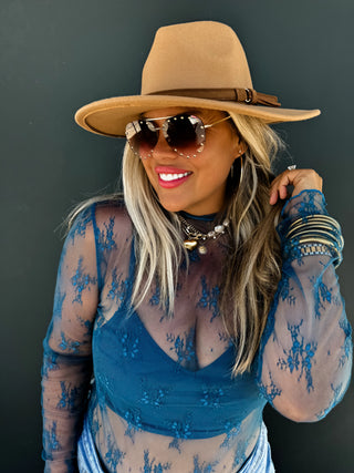 Woman wearing the Roxy Lace Top, styled for a feminine, elegant look.