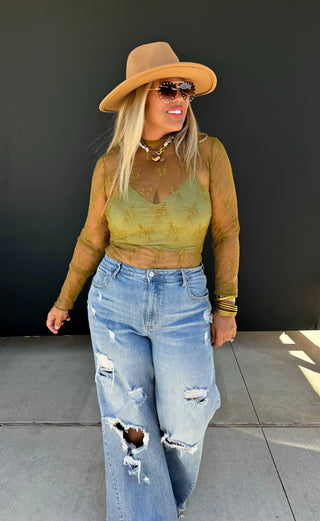 Roxy Lace Top styled with accessories for a chic, feminine outfit perfect for day-to-night wear.