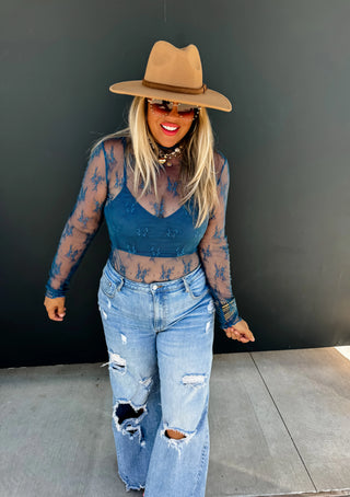 Roxy Lace Top styled with accessories for a chic, feminine outfit perfect for day-to-night wear.