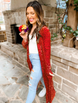 Woman wearing the Mabel Mesh & Velvet Duster, styled with a chic outfit for a sophisticated, elegant look.