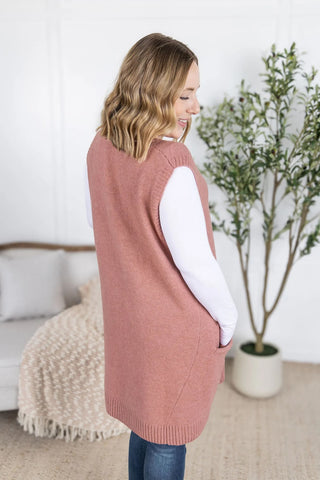 Back view of the rose-colored tunic vest, showing relaxed fit and mid-thigh length.