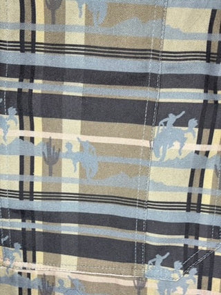 Close-up of plaid fabric with cowboy silhouette pattern