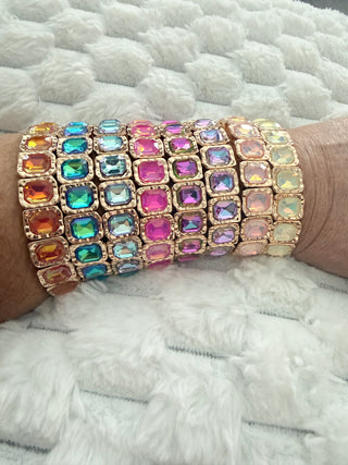 Gold stretch bracelet with faceted crystal gemstones available in multiple colors.