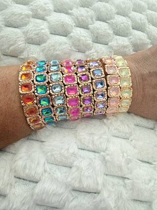 Gold stretch bracelet with faceted crystal gemstones available in multiple colors.