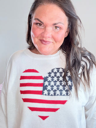 USA Flag Heart Sweater – Stylish oversized sweater with a classic American flag heart design, perfect for Fourth of July, Memorial Day, or everyday patriotic style.