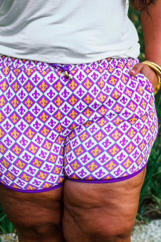 Close-up view of the vibrant print and drawstring waistband on the Life Of The Mardi Drawstring Everyday Shorts.