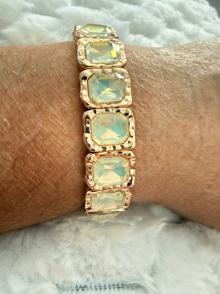 Gold stretch bracelet with faceted crystal gemstones available in multiple colors.