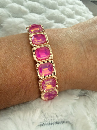 Gold stretch bracelet with faceted crystal gemstones available in multiple colors.