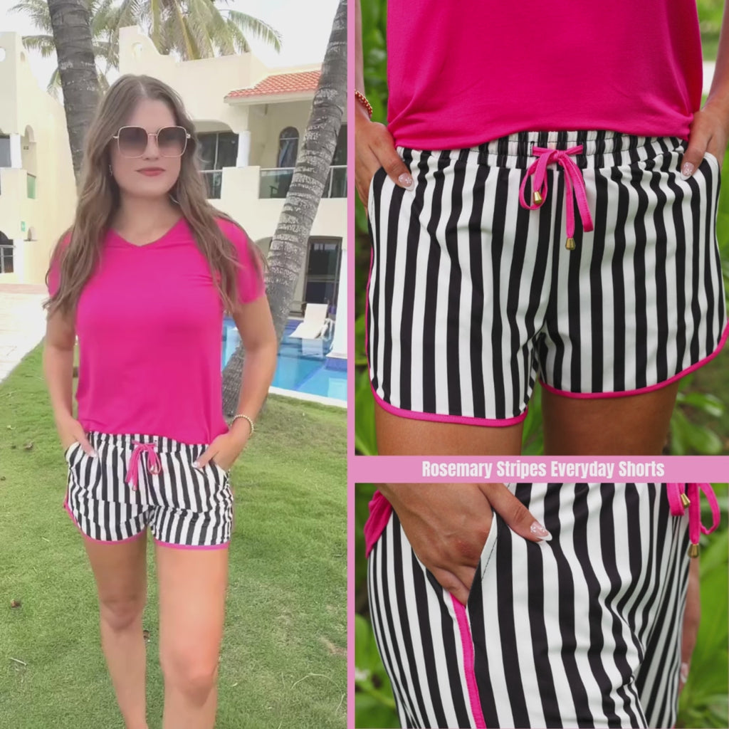 Black and white striped mid-rise everyday shorts with pink accents, relaxed fit, drawstring tie waist, and side pockets, styled for casual spring and summer wear.