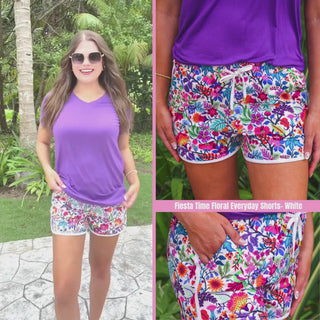White floral printed mid-rise everyday shorts with a relaxed fit, drawstring tie waist, and side pockets, styled for casual spring and summer wear.